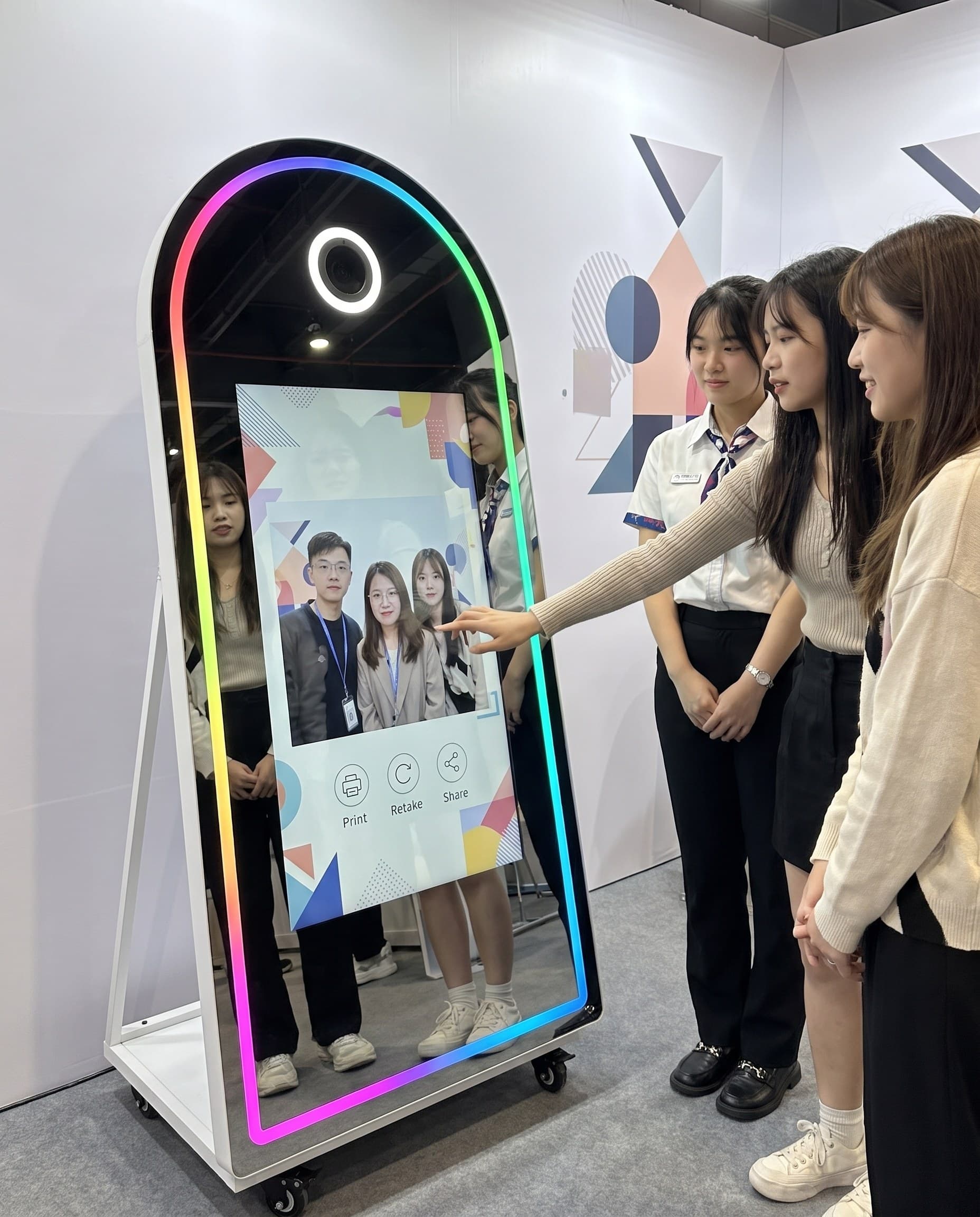 Guests and brand staff interacting at the magic mirror at a launch
