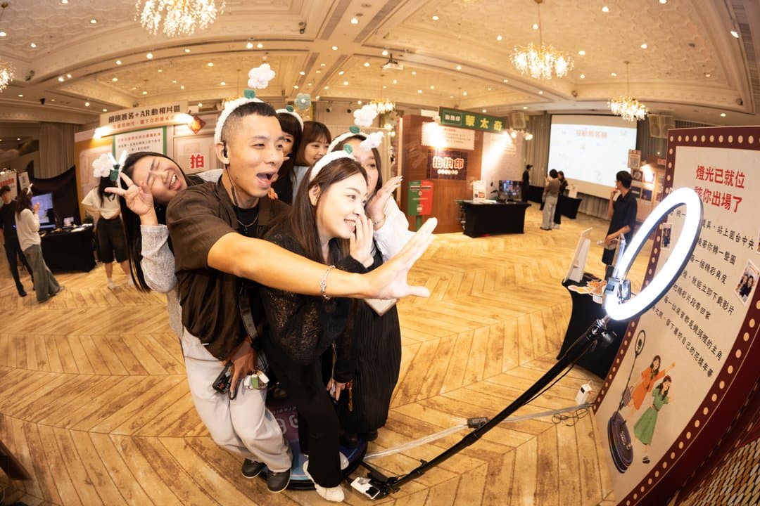 Wide view of the AR photo zone with guests queuing to shoot and scan